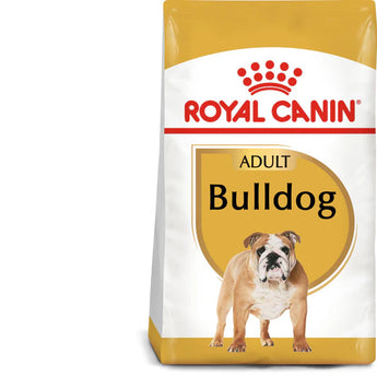 A package of Royal Canin Adult Bulldog dry dog food. The bag is white with a yellow bulldog logo and a tailor-made kibble image, indicating that it is specially formulated for Bulldogs.