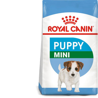 A bag of Royal Canin Mini Puppy dry dog food with a picture of a puppy on the front. The label highlights health nutrition and immune system support.