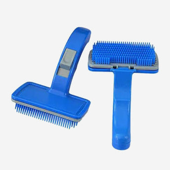 Blue pet grooming brush on a white background