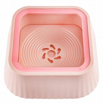 Pink pet bowl with floral design on a white background